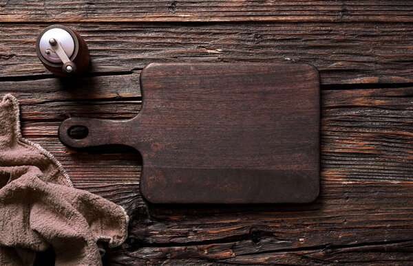 Empty cutting board on a wood table