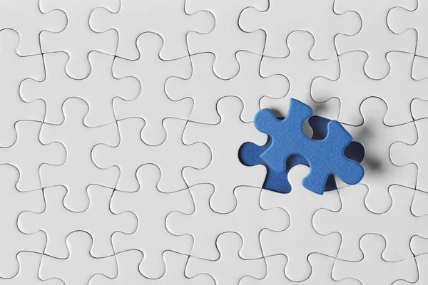 Blue Puzzle Piece White Puzzle Pieces — Stock Photo, Image