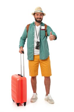 Cheerful man with summer clothing and luggage, white background