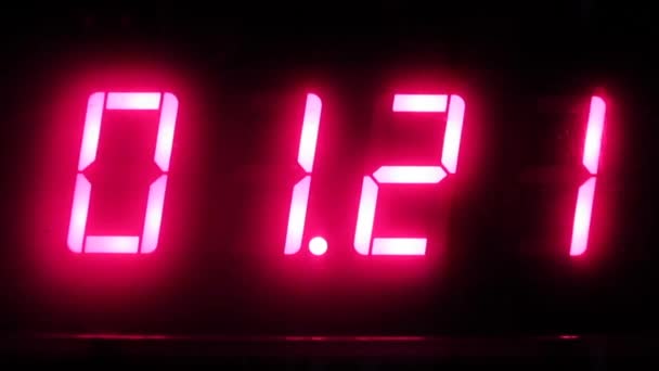 Electronic Clock Shows Time Night — Video Stock