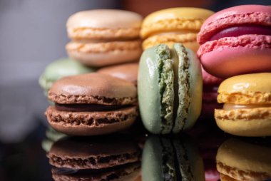 Colorful macaroons in a dark setting