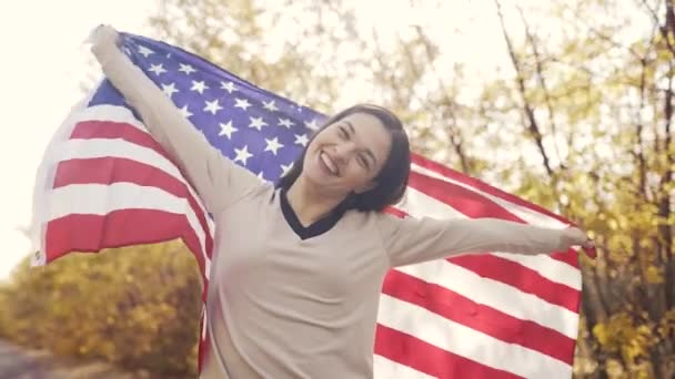 Cheerful woman with USA flag — Stock Video