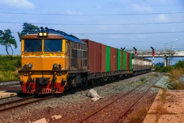 Freight train by diesel locomotive on the railway 