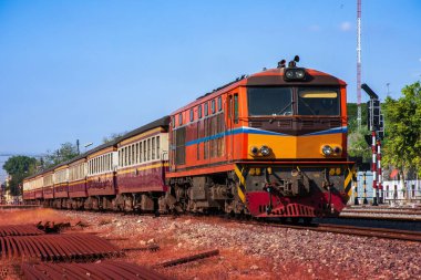 Passenger train by diesel locomotive on the railway 