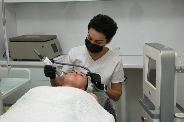 Facial skin rejuvenation using electric radio waves for a woman over forty years old