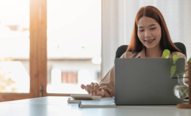 Accountant businesswoman working with calculator for financial document in office. male accountant doing accounting and calculating. bookkeeper making calculation. Savings, finance.