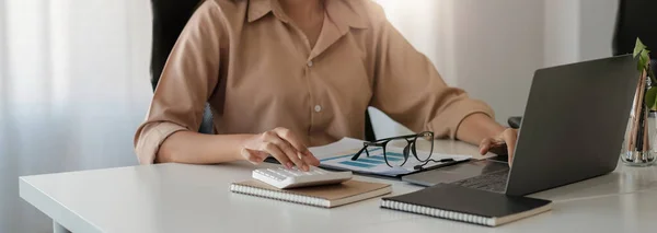 Accountant businesswoman working with calculator for financial document in office. male accountant doing accounting and calculating. bookkeeper making calculation. Savings, finance. — Stockfoto