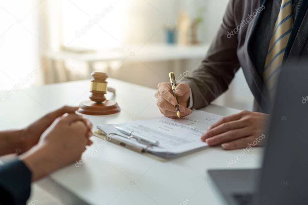 Businesswoman and female lawyer or judge consult having team meeting with client, Law and treaty of the law. Sign a contract business