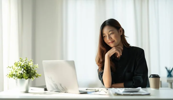 Portrait of Young Smart Asian Woman Freelance Online Working from Home with Laptop at Home Living Room in Coronavirus or Covid-19 Outbreak Situation - Health and Social Distancing Concept — 스톡 사진