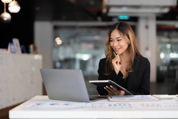 Young business asian woman working on laptop in office for accounting financial concept — Stok fotoğraf