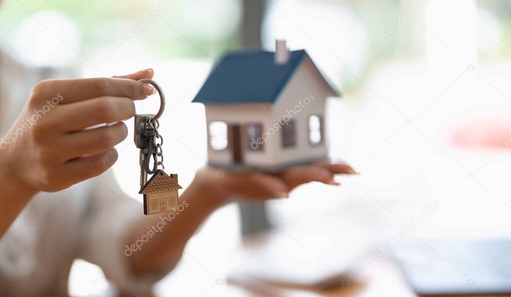 Real estate agent handing over keys to home