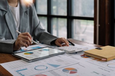 Finance manager discussing company growth project success financial statistics, professional investor working start up project for strategy plan with document, laptop and digital tablet.