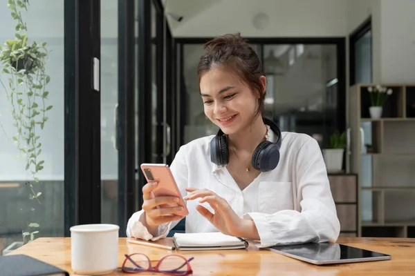 Close Young Asian Woman Using Mobile Smart Phone While Study — Stockfoto