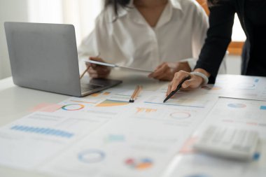 Business People Meeting to discuss and brainstorming financial report paperwork in office. Financial advisor teamwork and accounting concept. close up shot.