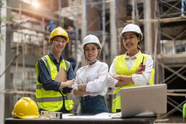Portrait group of asian engineers and architect working on site