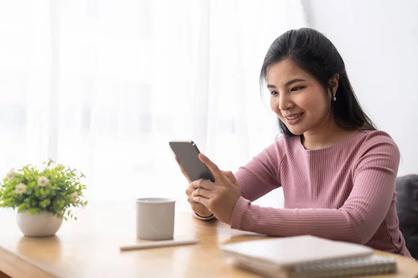 Happy Young Asian Woman Using Mobile Phone — Fotografia de Stock