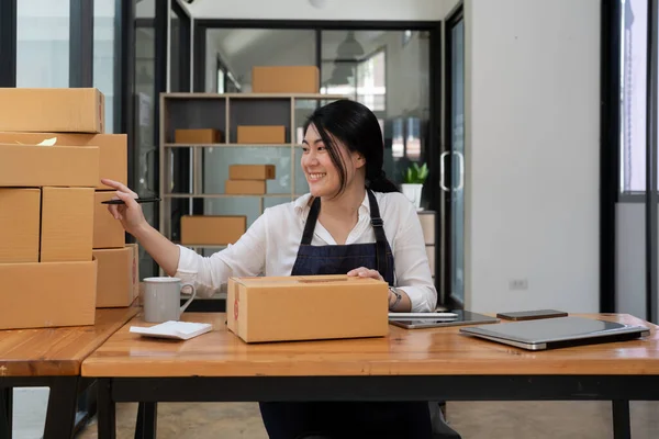 Smiling Entrepreneur Checking Order Delivery Box Work Desk Home — Fotografia de Stock
