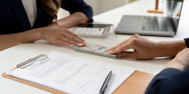 business partners signing contract to borrow money from investor to invest at own business - money loan concept