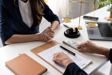 Business people negotiating a contract. Human hands working with documents at desk and signing contract