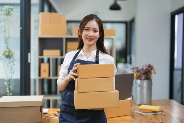 Portrait asian woman business owner with small business at home office