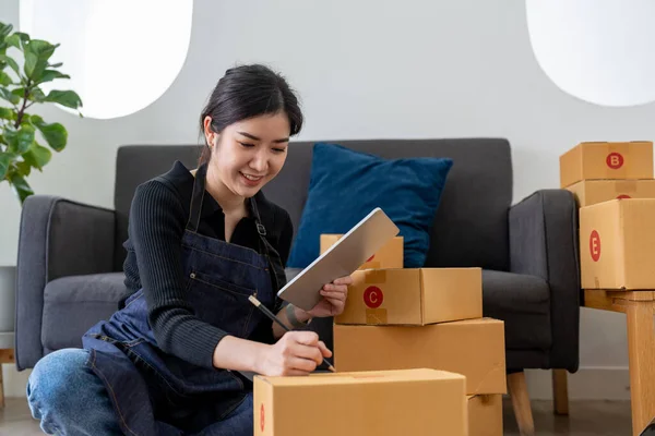 Small Entrepreneurs Start A Home Business By Arranging Goods With Brown Parcel Boxes, Small Home Business Startup Ideas