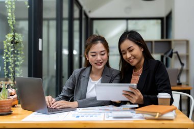 Business adviser meeting for analysis data figures to plan business strategies. Business discussing concept.