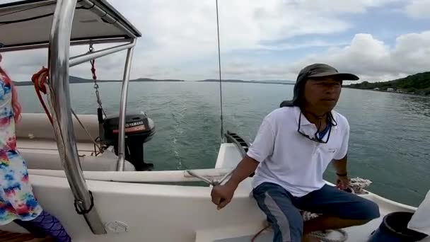 Thai Captain Controls Helm Sailing Catamaran While Traveling Sea — Stock Video