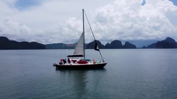 Sailboat Anchored Phang Nga Bay Thailand High Seas Mountains Distance ストック映像