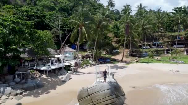 Guy Stands Stone Coast Tropical Beach — Video Stock