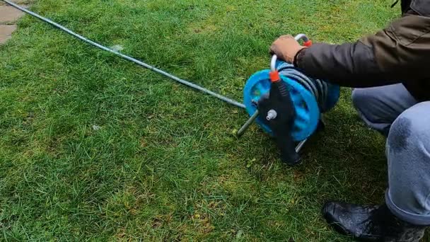 Man Spins Watering Hose Garden — Video Stock