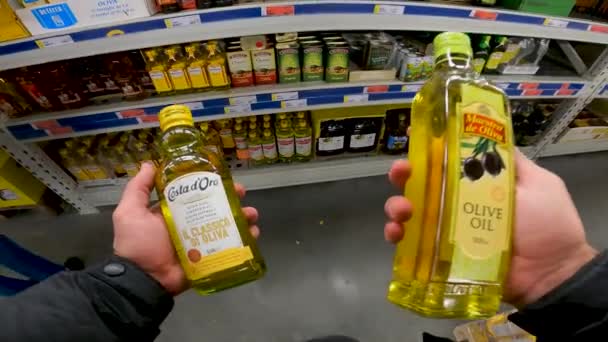 First Person View Buyer Chooses Which Olive Oil Buy — Stockvideo