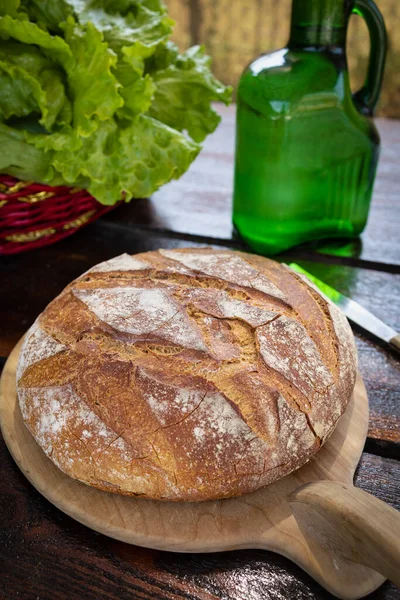 Freshly baked loaf of wheat bread. Homemade round and freshly baked bread. Delicious round and large bread.