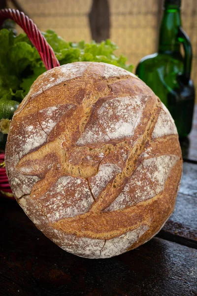 Freshly baked loaf of wheat bread. Homemade round and freshly baked bread. Delicious round and large bread.