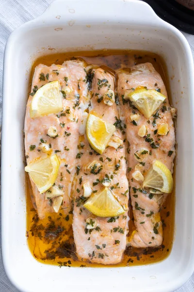 Baked salmon loins with olive oil, honey and garlic. Mediterranean and healthy cuisine