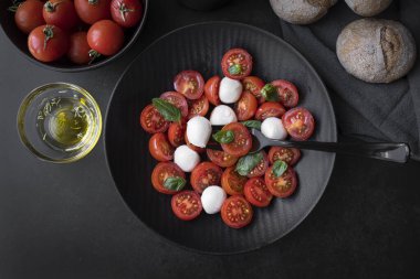 Cherry tomato salad with mozzarella cheese and fresh basil. Delicious caprese salad