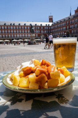 Aioli and bravas potatoes in Plaza Mayor in Madrid, Spain. Typical Spanish tapas
