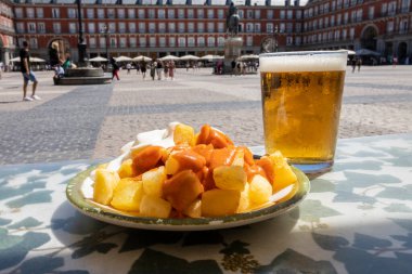 Aioli and bravas potatoes in Plaza Mayor in Madrid, Spain. Typical Spanish tapas