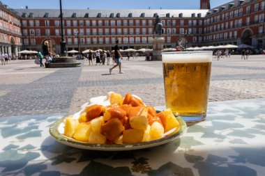 Aioli and bravas potatoes in Plaza Mayor in Madrid, Spain. Typical Spanish tapas