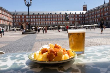 Aioli and bravas potatoes in Plaza Mayor in Madrid, Spain. Typical Spanish tapas
