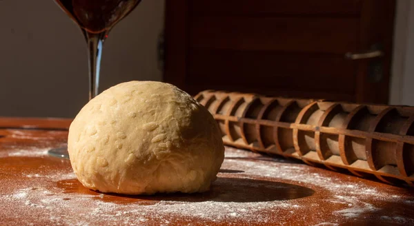 Photo of flour and men hands with flour splash. Cooking bread. Kneading the Dough. Isolated on dark background. Empty space for text.