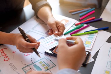 Teamwork process, Graphic designer creative planning work together on website ux ui app development.