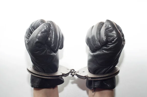 Fists Black Leather Gloves Fastened Handcuffs White Background — Stock Photo, Image