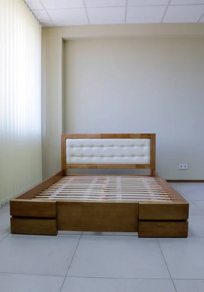 frame lacquered wooden double bed with slats, upholstered headboard, without mattress