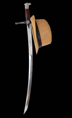 Cossack saber with a straw hat on an isolated black background