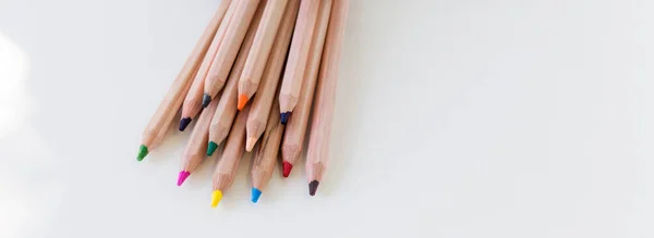 Multi Colored Pencils Lie White Background Close — Zdjęcie stockowe