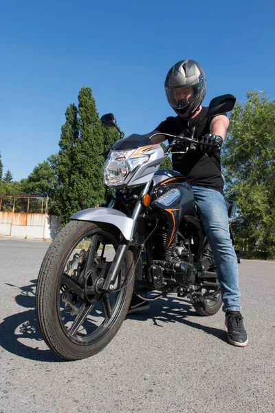 Guy Helmet Sits Motorcycle Looks Dashboard Starts Engine — Photo