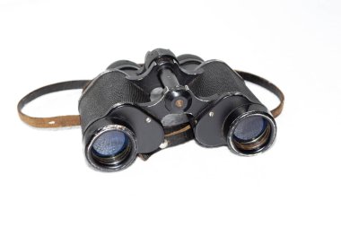 old binoculars with strap on white background
