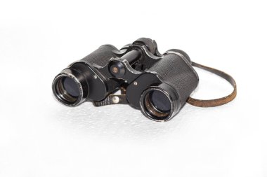 old binoculars with strap on white background