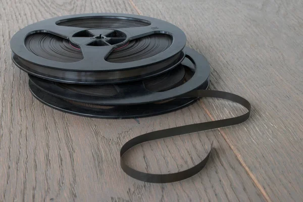 reels of magnetic tape from a vintage audio tape recorder, close-up