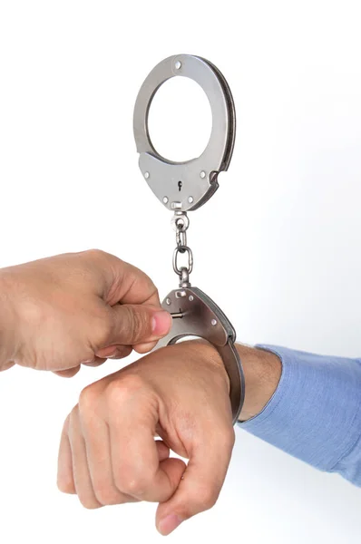 Remove Handcuffs Hand Unfastens Handcuffed Hand Key Isolated White Background — Zdjęcie stockowe